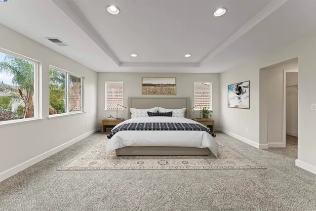 a bathroom with a sink a bathtub and next to a window