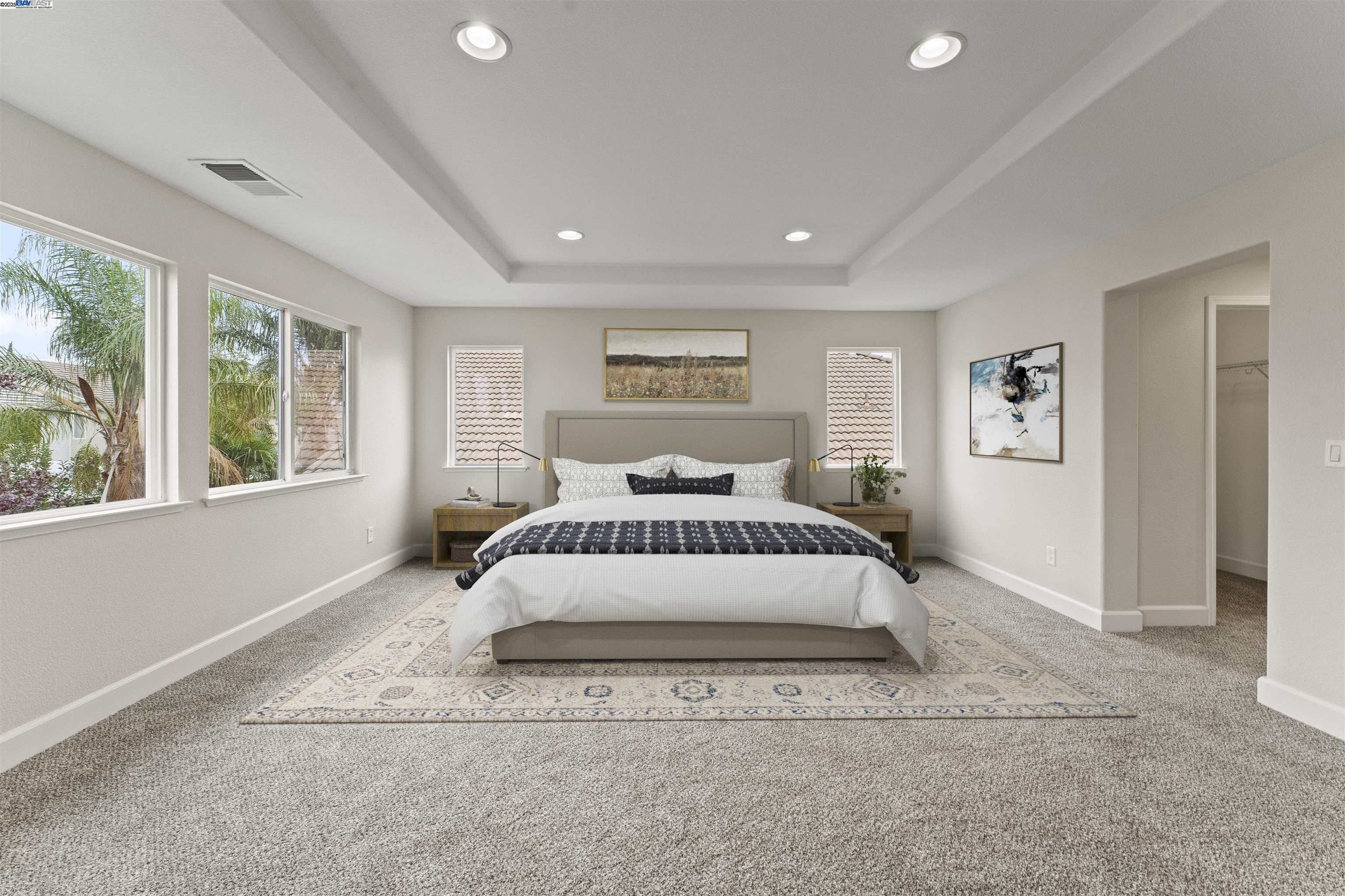 204 Daylilly Lane Patterson, CA 95363 - Photo 36 of 52 a large white bed in a white room