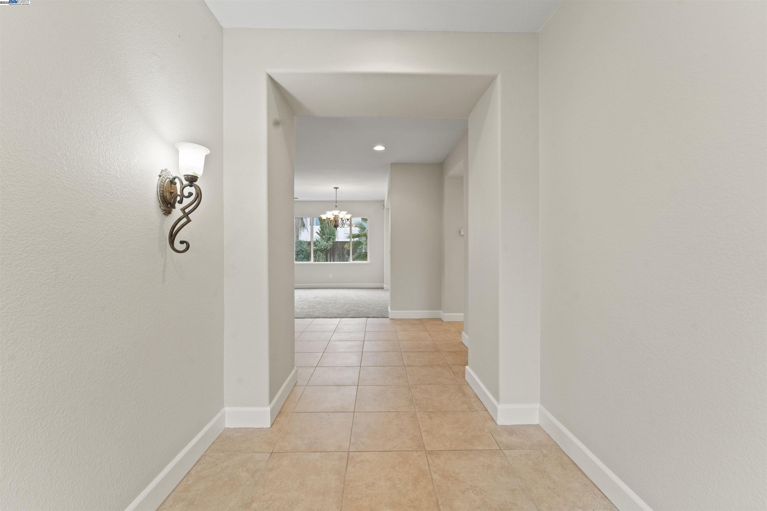 204 Daylilly Lane Patterson, CA 95363 - Photo 4 of 52 a view of a hallway with closet