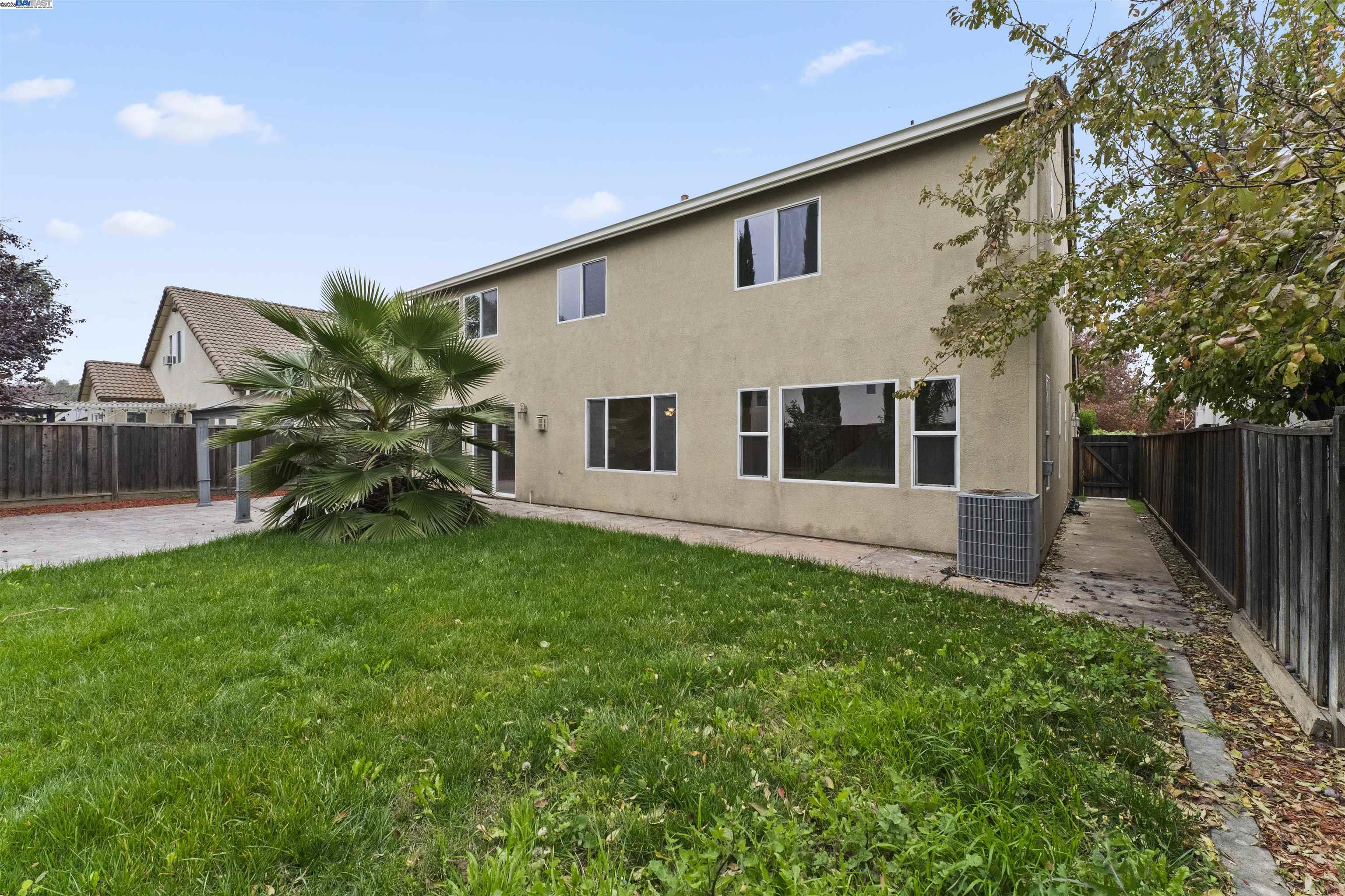 204 Daylilly Lane Patterson, CA 95363 - Photo 47 of 52 a house view with a garden space