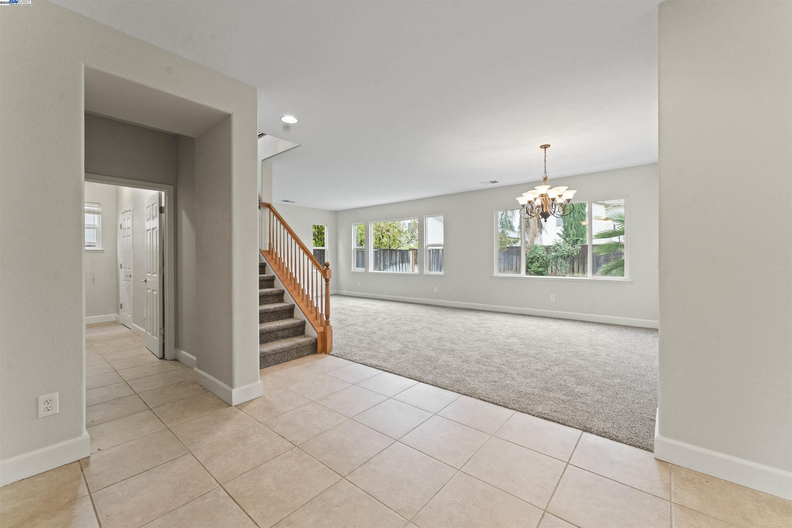 204 Daylilly Lane Patterson, CA 95363 - Photo 5 of 52 an entryway with an empty room
