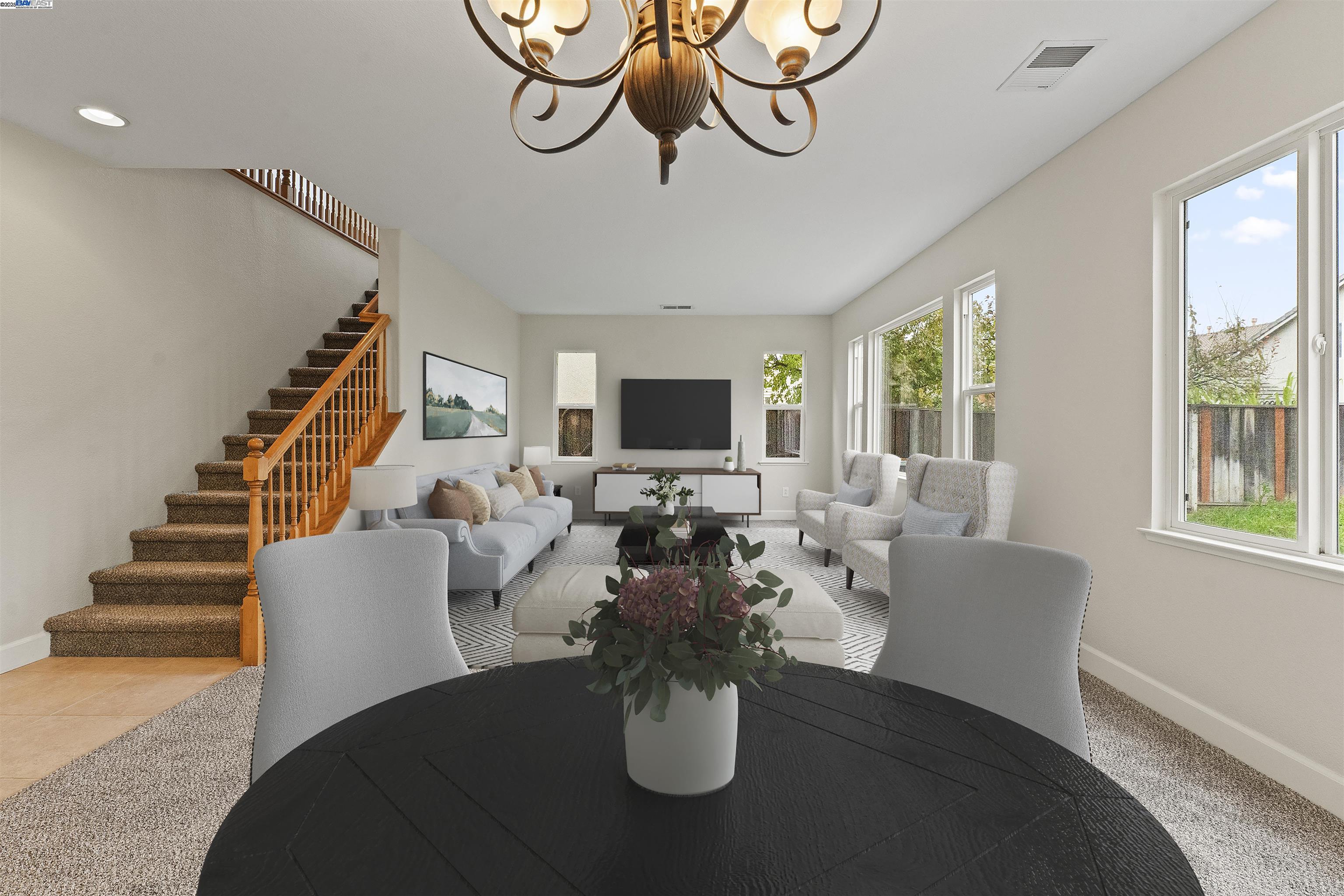 204 Daylilly Lane Patterson, CA 95363 - Photo 7 of 52 a view of a dining room with furniture wooden floor and chandelier