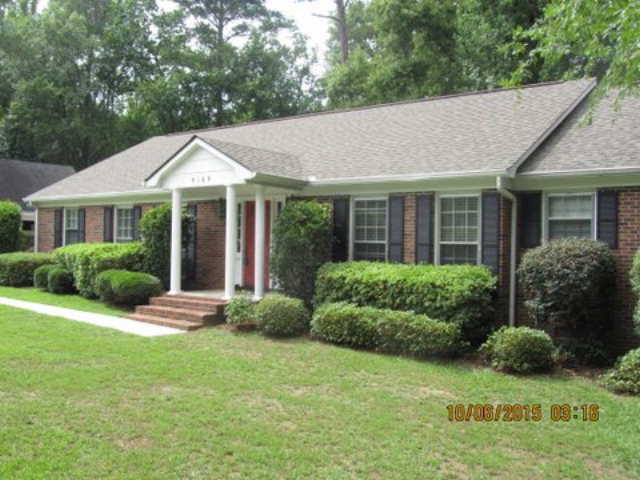 5165 Zebulon Road Macon, GA 31210 - Photo 1 of 28 a view of a house with a yard and plants