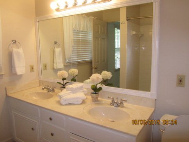 5165 Zebulon Road Macon, GA 31210 - Photo 15 of 28 a bathroom with a double vanity sink and a mirror