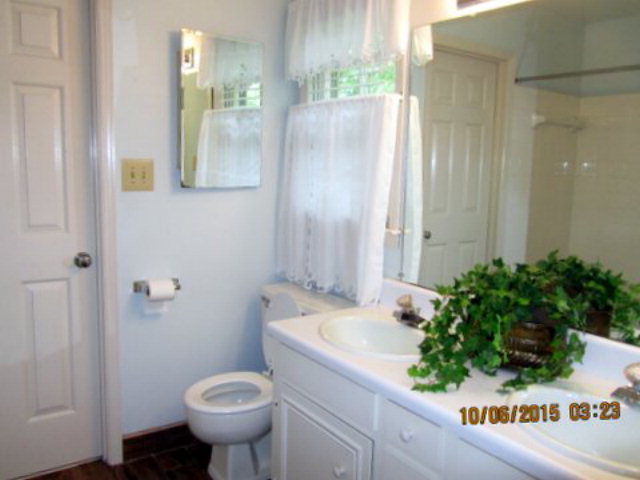 5165 Zebulon Road Macon, GA 31210 - Photo 19 of 28 a bathroom with a sink and mirror