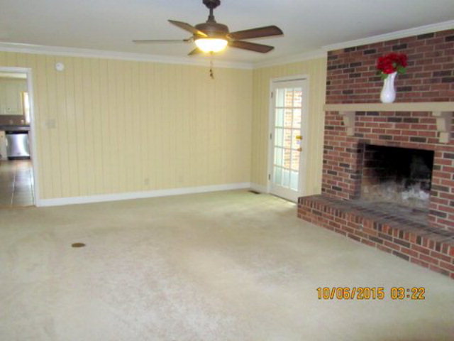 5165 Zebulon Road Macon, GA 31210 - Photo 5 of 28 a living room with furniture and a fireplace
