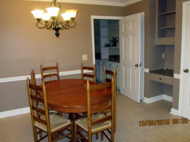 5165 Zebulon Road Macon, GA 31210 - Photo 10 of 28 a view of a dining room with furniture and chandelier