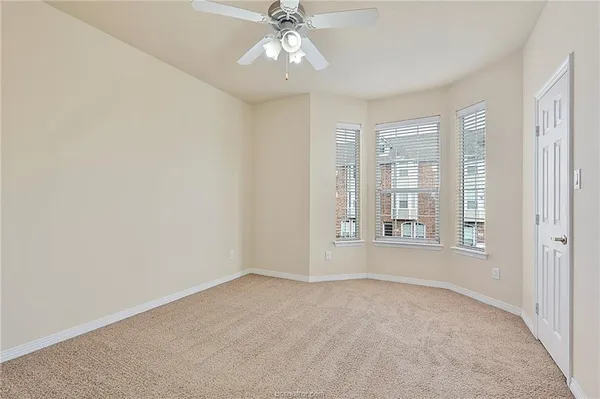 a bedroom with bed and window