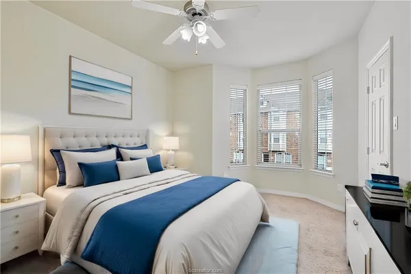 a view of an empty room with a ceiling fan