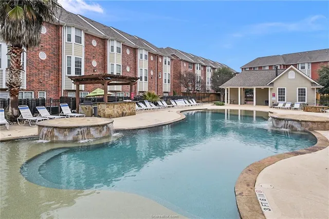 a view of a house with swimming pool and porch
