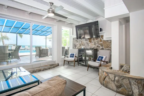 a balcony with furniture and wooden floor