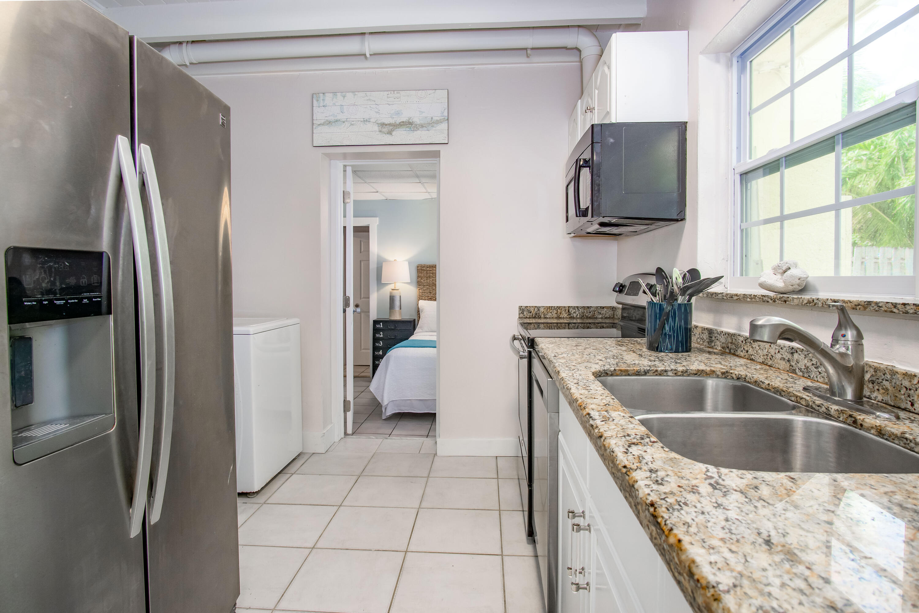 901 46th Street Marathon, FL 33050 - Photo 31 of 79 a kitchen with a refrigerator sink and microwave