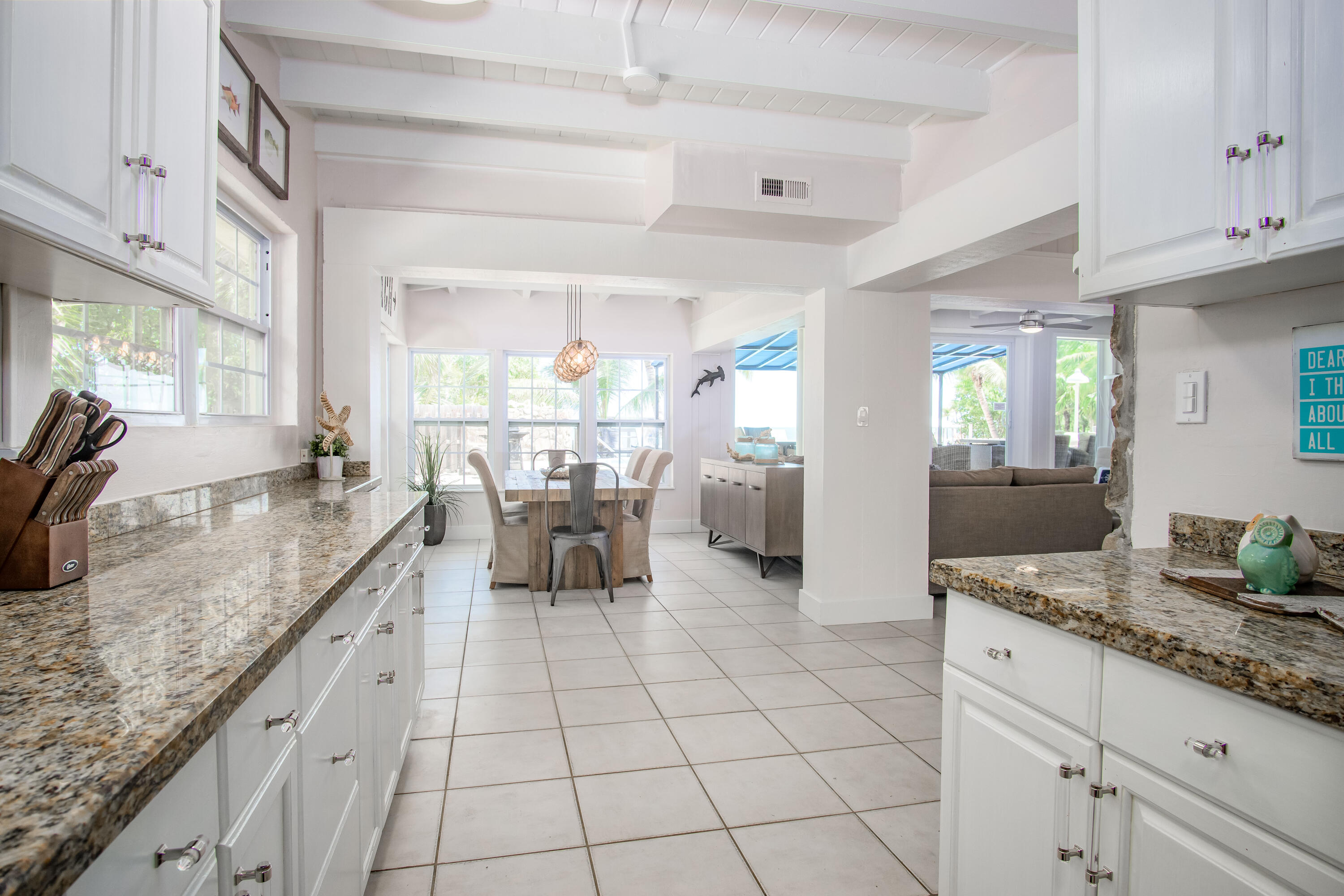 901 46th Street Marathon, FL 33050 - Photo 32 of 79 a large kitchen with granite countertop a sink and cabinets