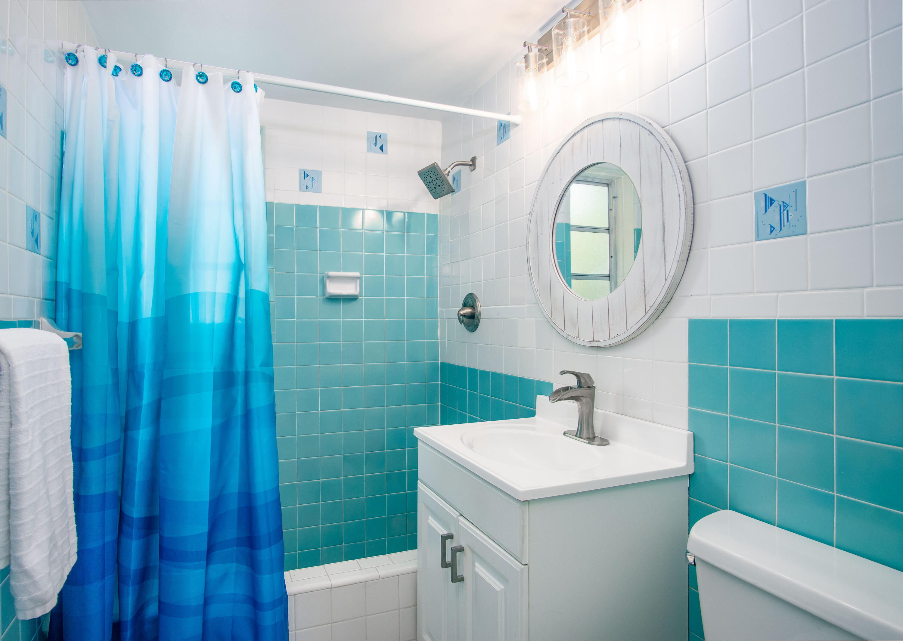 901 46th Street Marathon, FL 33050 - Photo 38 of 79 a bathroom with a sink a toilet and a mirror