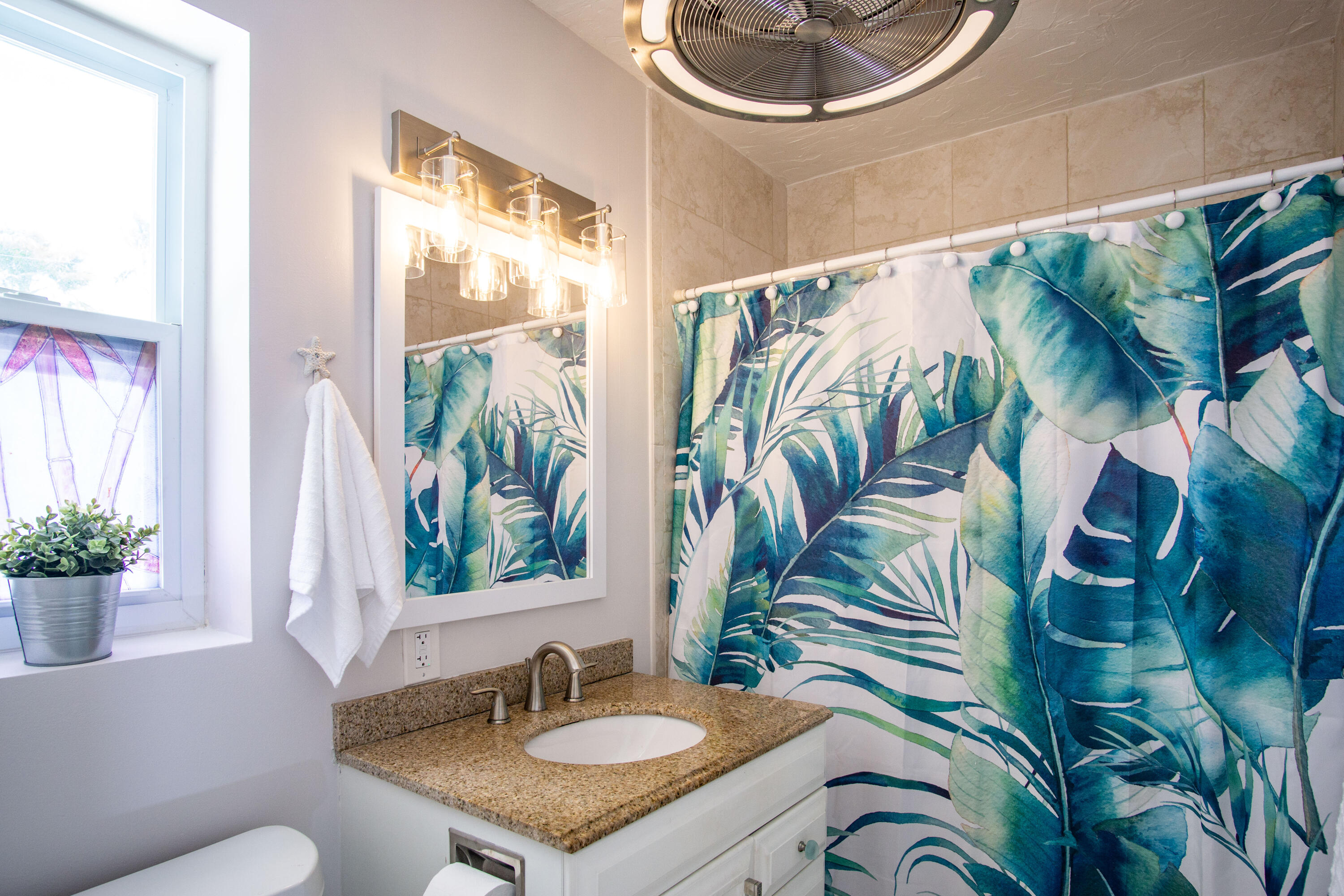 901 46th Street Marathon, FL 33050 - Photo 52 of 79 a bathroom with a sink a mirror and a toilet