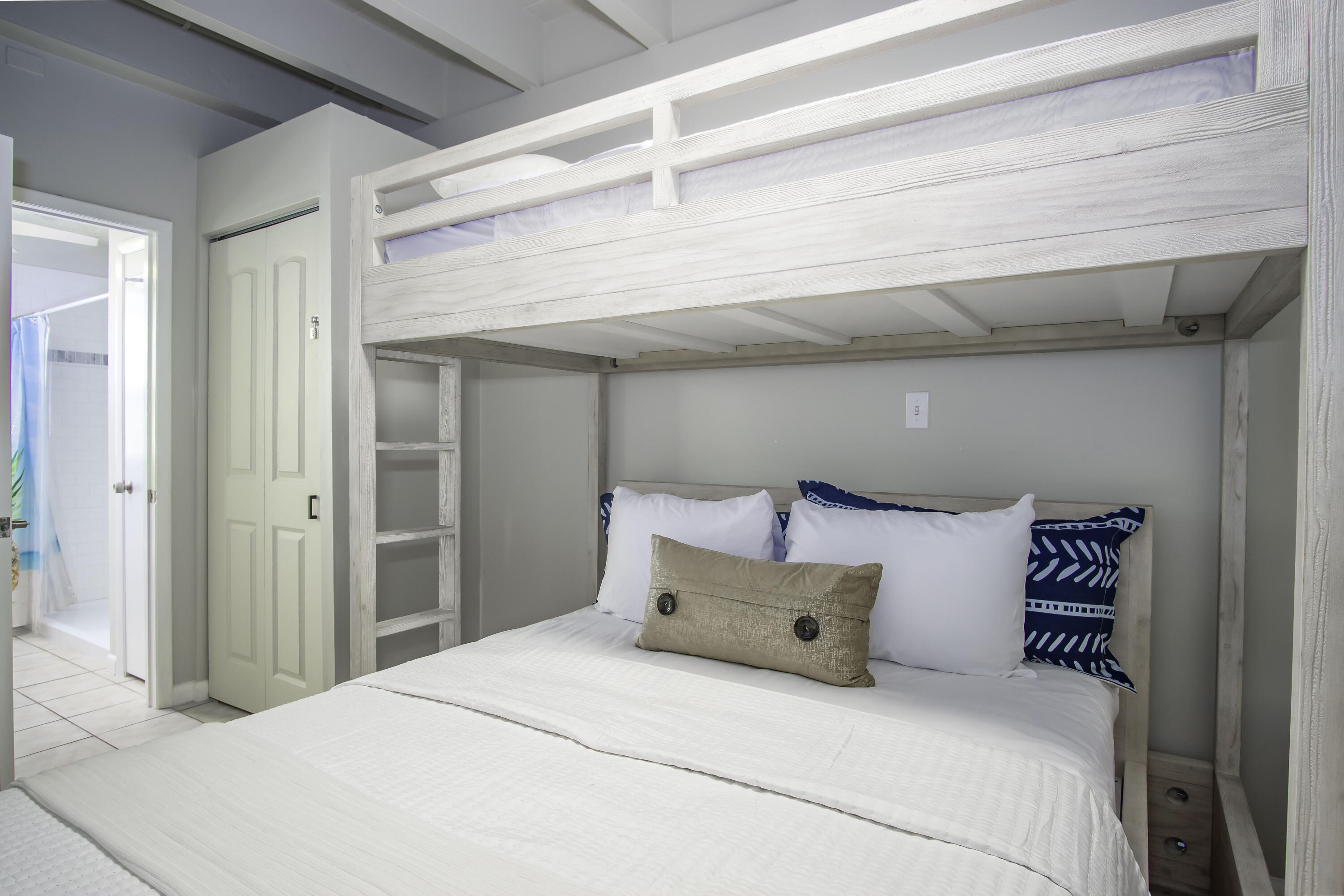 901 46th Street Marathon, FL 33050 - Photo 72 of 79 a large bed sitting in a bedroom next to a window and a chandelier