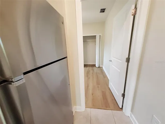 a kitchen with a sink stove and refrigerator