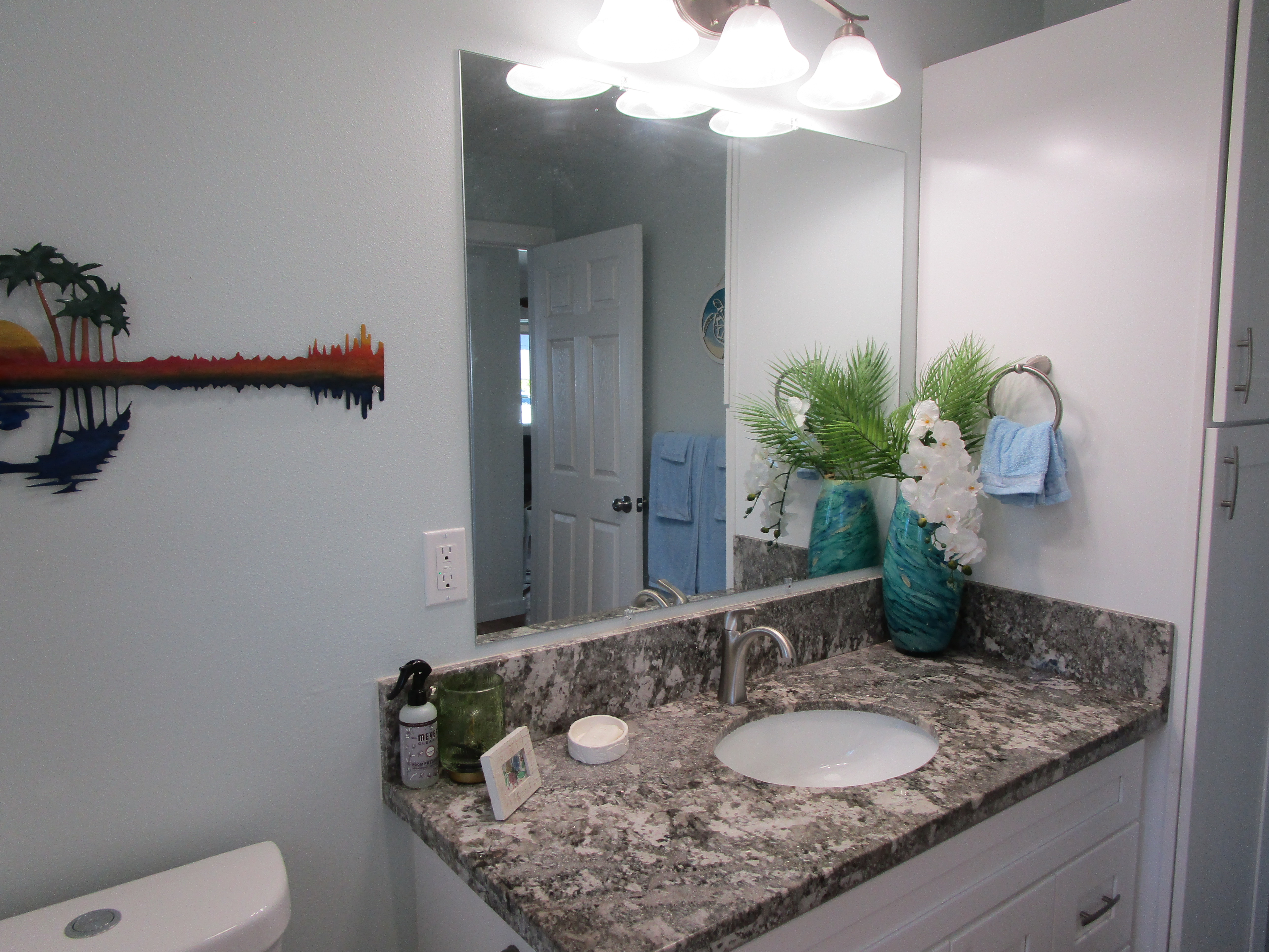 1 Kokokahi Road Mountain View, HI 96771 - Photo 14 of 27 a bath room with a granite countertop sink and a mirror