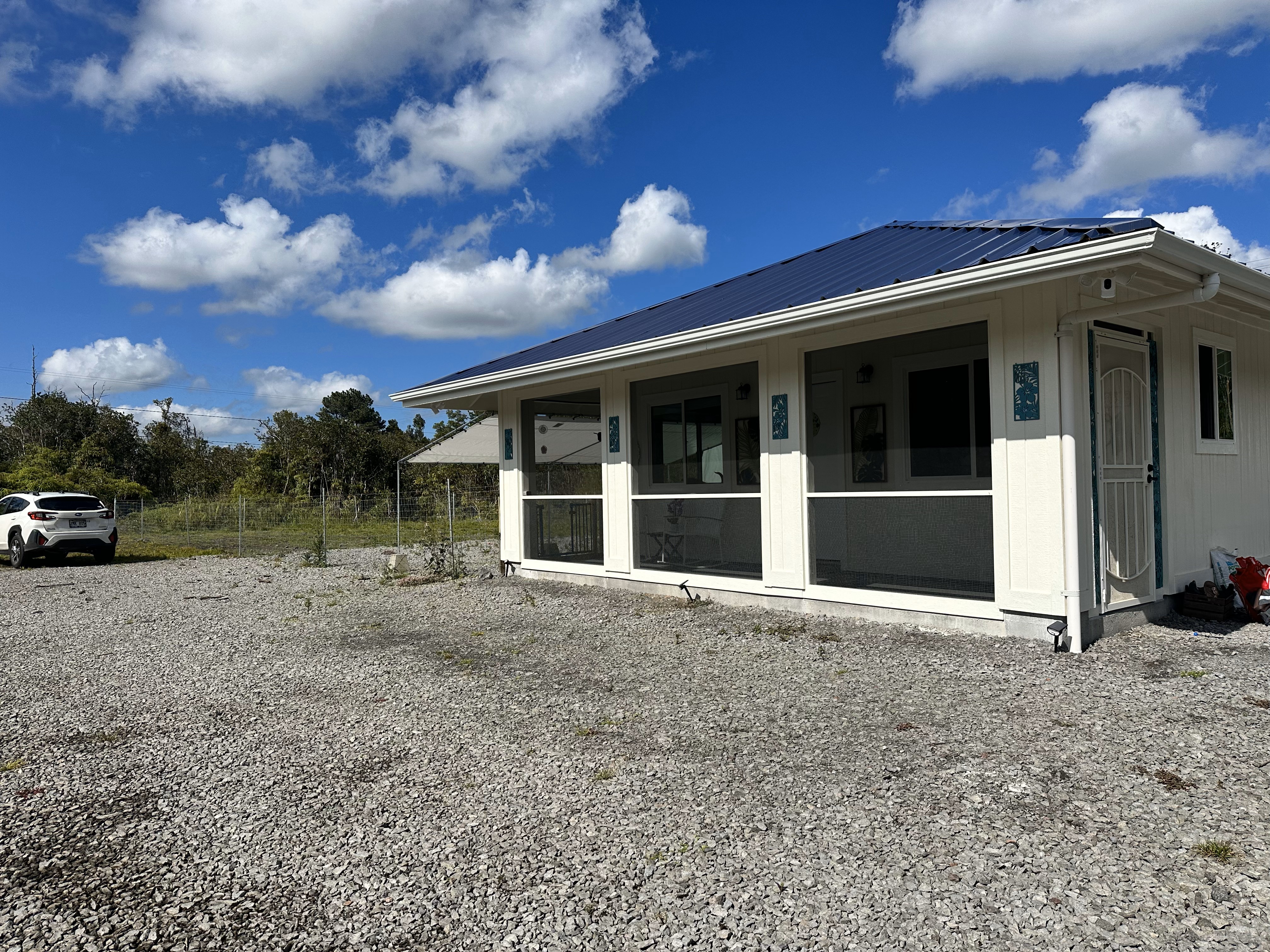 1 Kokokahi Road Mountain View, HI 96771 - Photo 2 of 27 a view of a house with a garden