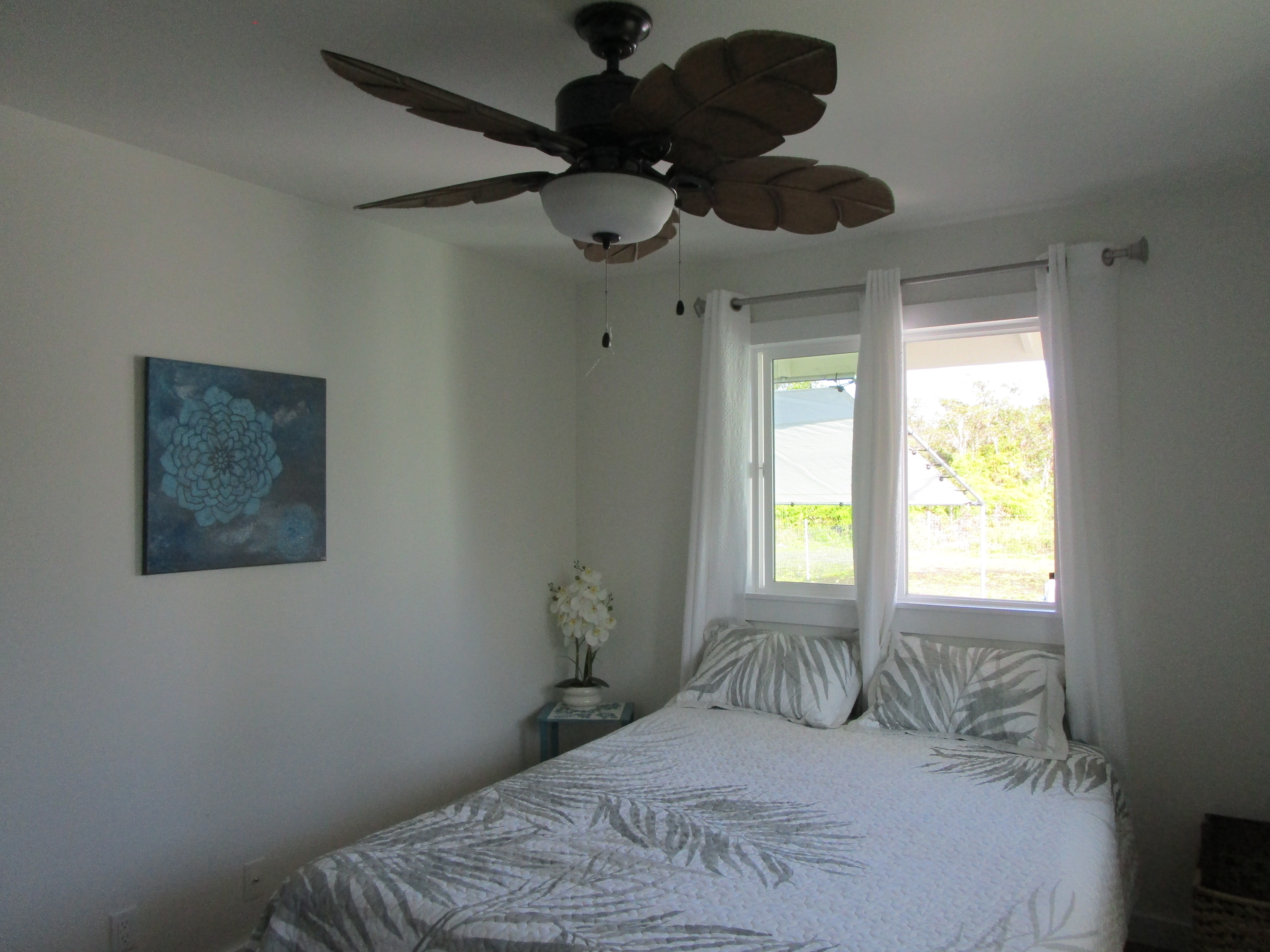 1 Kokokahi Road Mountain View, HI 96771 - Photo 9 of 27 a bedroom with a bed and a window