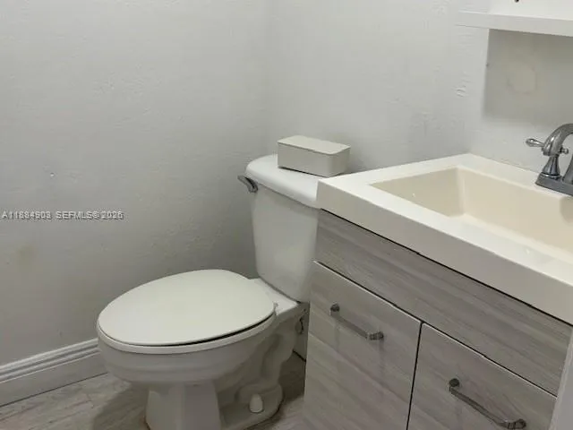 an empty room with wooden floor