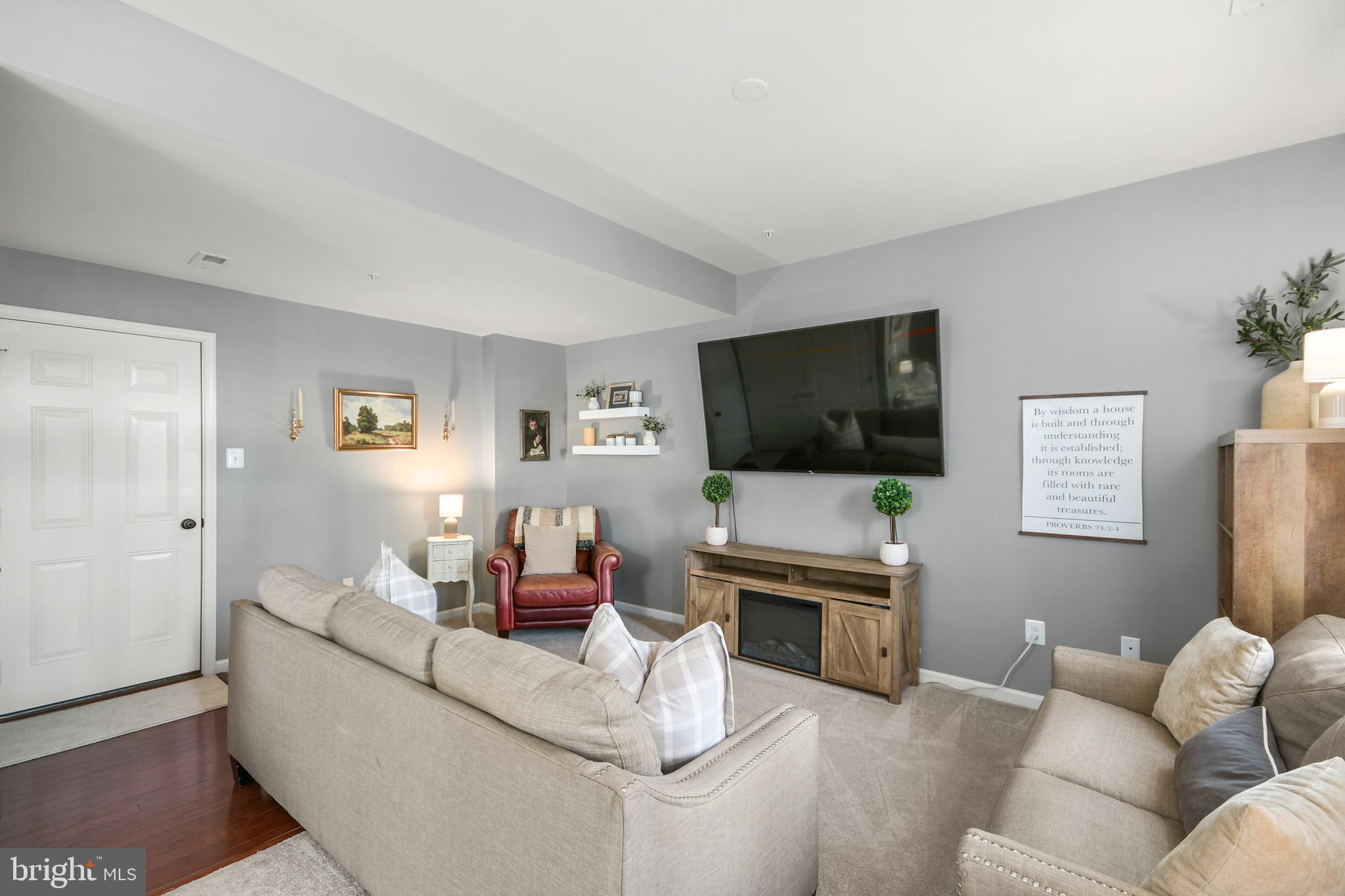 2709 Osprey Way North Frederick, MD 21701 - Photo 15 of 64 a living room with furniture and a flat screen tv