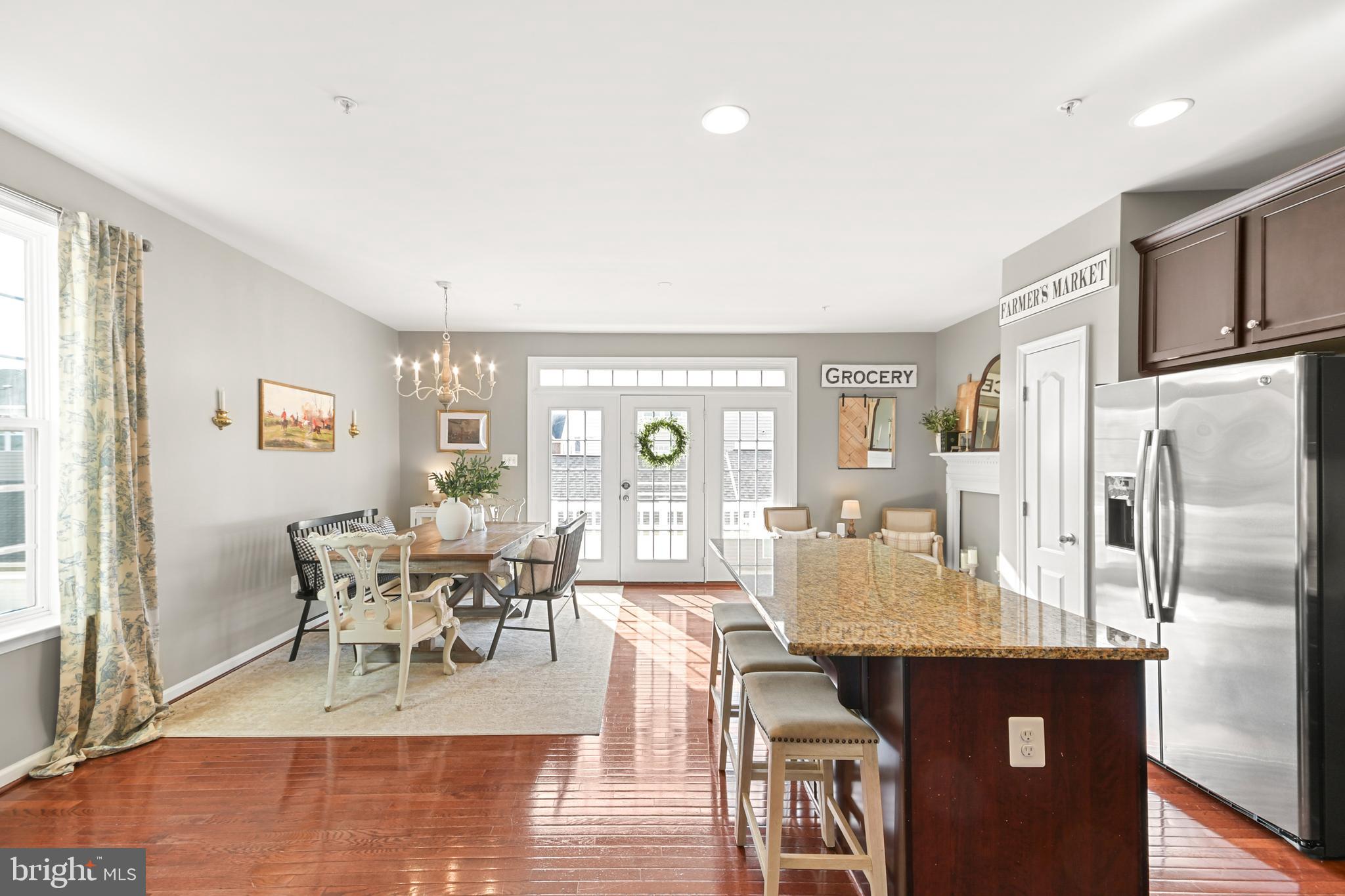 2709 Osprey Way North Frederick, MD 21701 - Photo 22 of 64 a view of a dining room with furniture window and wooden floor