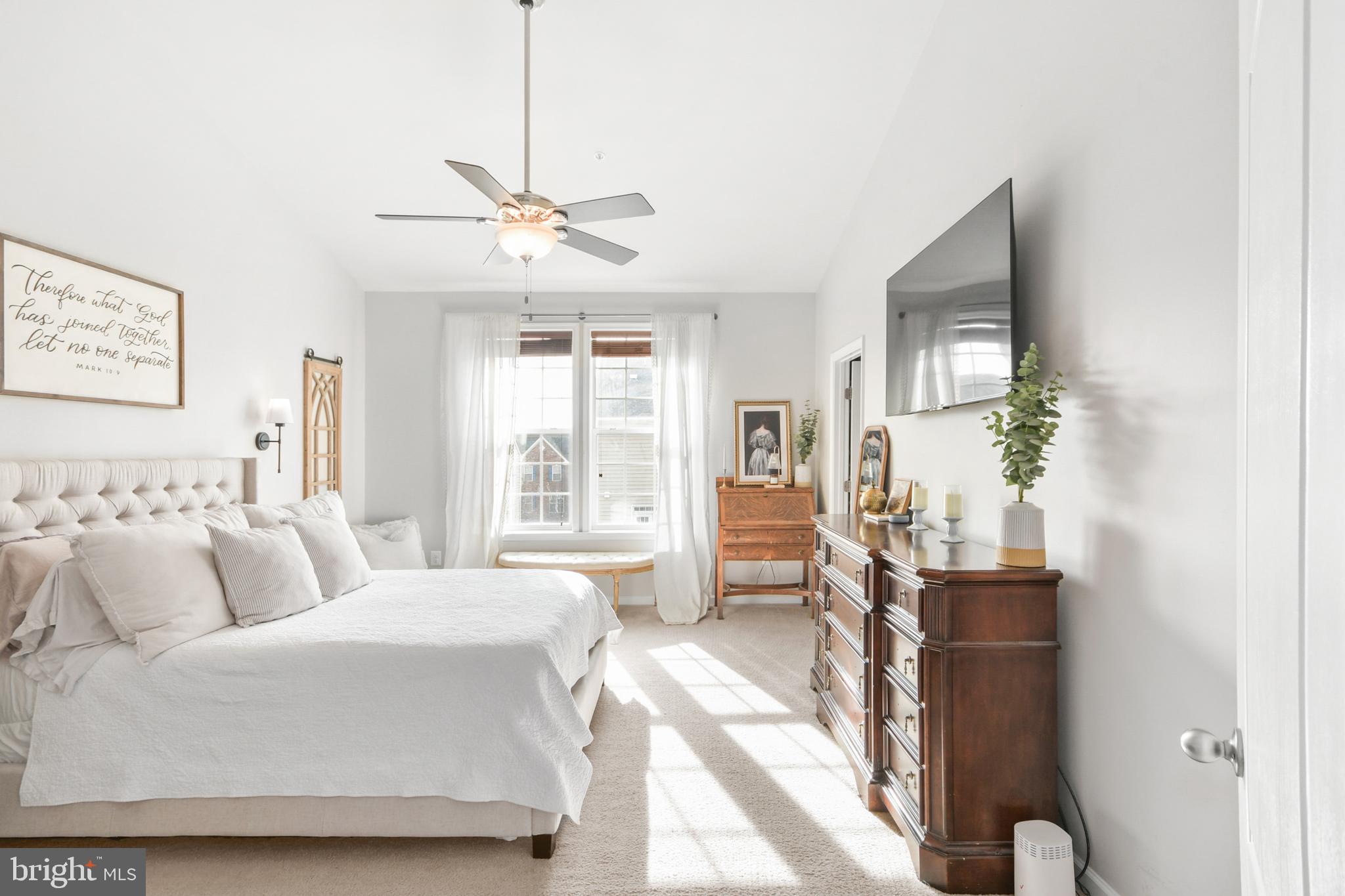 2709 Osprey Way North Frederick, MD 21701 - Photo 42 of 64 a bedroom with a balcony a bed and a chandelier