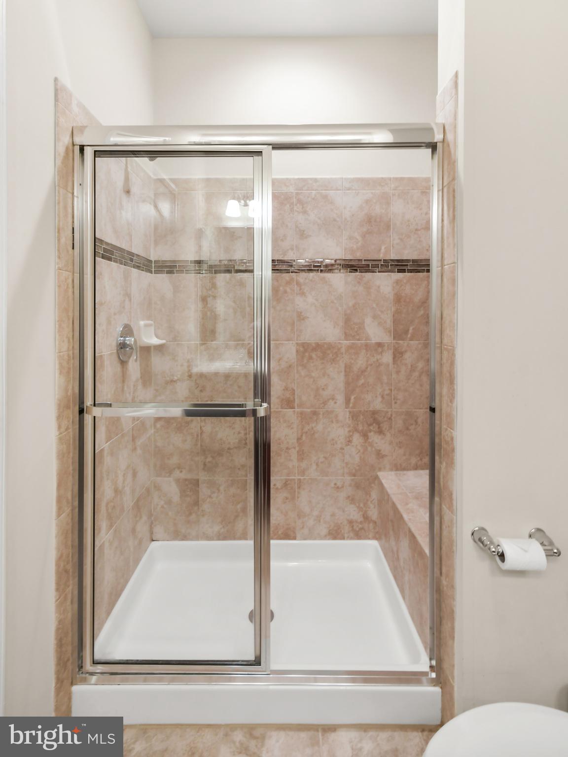 2709 Osprey Way North Frederick, MD 21701 - Photo 48 of 64 a bathroom with a glass shower door