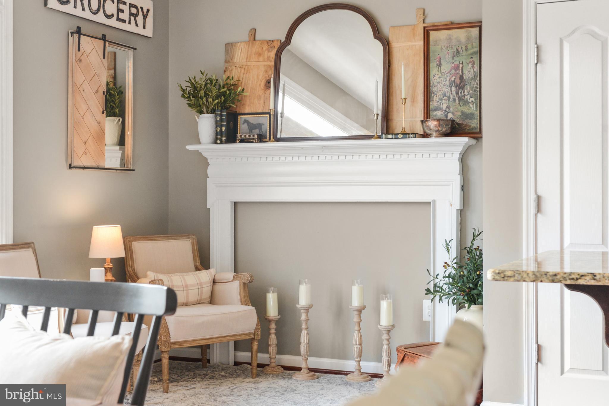 2709 Osprey Way North Frederick, MD 21701 - Photo 5 of 64 a living room with furniture and a fireplace