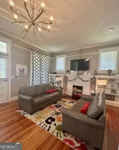 a living room with furniture fireplace and a flat screen tv