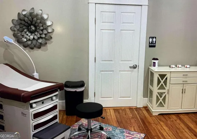 a room with furniture and wooden floor