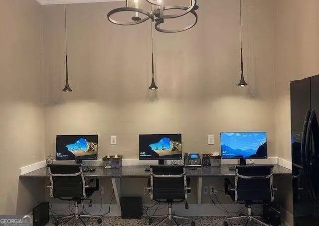 a view of a workspace with furniture