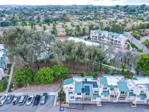 an aerial view of a house with outdoor space