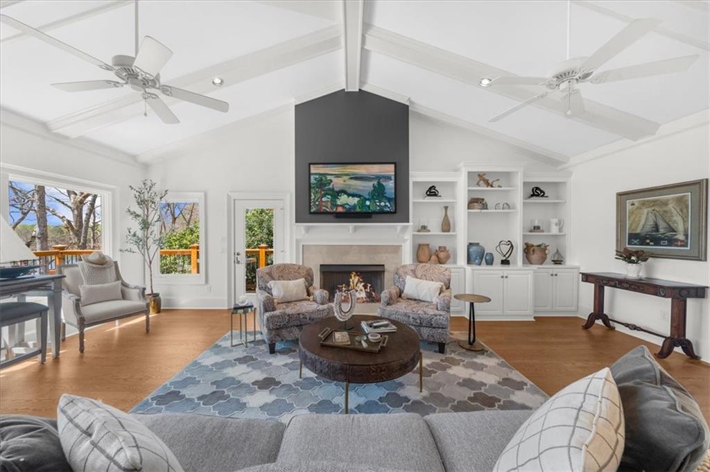 9230 Four Mile Creek Road Gainesville, GA 30506 - Photo 11 of 67 a living room with furniture a fireplace and a flat screen tv