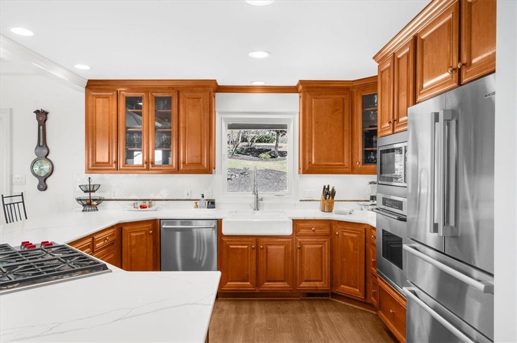 9230 Four Mile Creek Road Gainesville, GA 30506 - Photo 15 of 67 a kitchen that has a sink and a stove