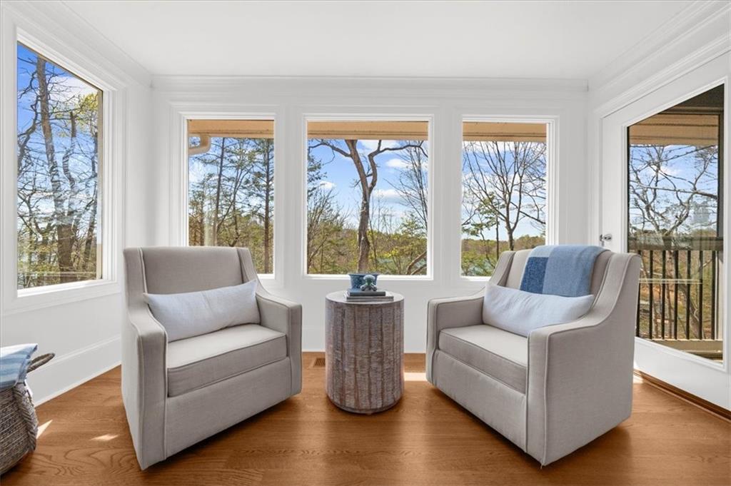 9230 Four Mile Creek Road Gainesville, GA 30506 - Photo 20 of 67 a living room with furniture and floor to ceiling windows