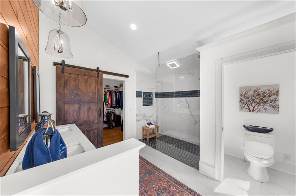 9230 Four Mile Creek Road Gainesville, GA 30506 - Photo 21 of 67 a living room with a couch and a chandelier