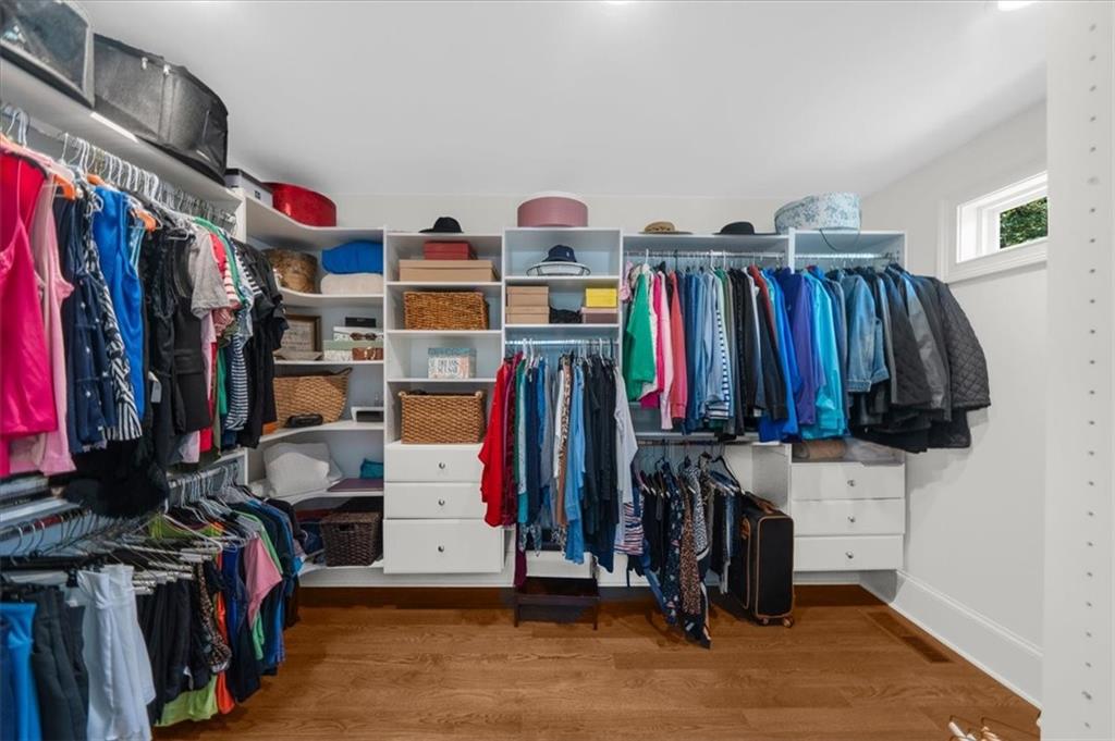 9230 Four Mile Creek Road Gainesville, GA 30506 - Photo 24 of 67 a view of walk in closet with clothes and shoes