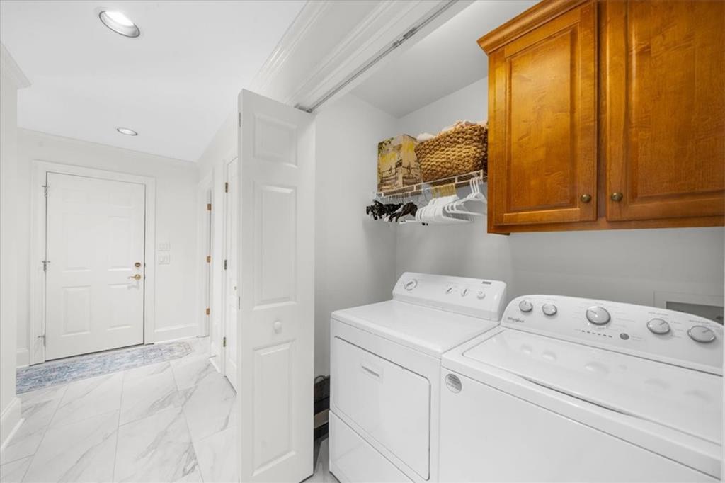 9230 Four Mile Creek Road Gainesville, GA 30506 - Photo 26 of 67 a view of storage and utility room with washer and dryer