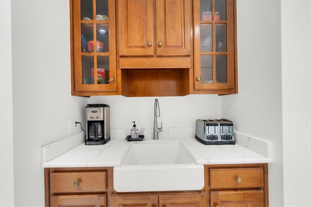 9230 Four Mile Creek Road Gainesville, GA 30506 - Photo 27 of 67 a bathroom with a sink and a microwave