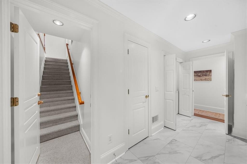 9230 Four Mile Creek Road Gainesville, GA 30506 - Photo 28 of 67 a view of a hallway with entryway and stairs