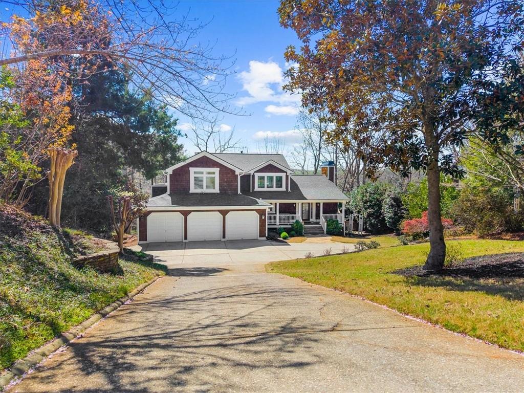 9230 Four Mile Creek Road Gainesville, GA 30506 - Photo 3 of 67 a house with trees in front of it