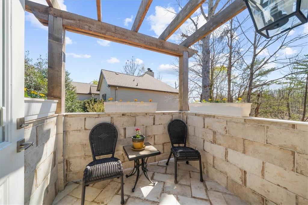 9230 Four Mile Creek Road Gainesville, GA 30506 - Photo 32 of 67 a view of a chairs and table in the balcony