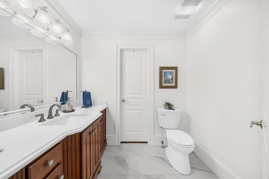 9230 Four Mile Creek Road Gainesville, GA 30506 - Photo 33 of 67 a bathroom with a double vanity sink mirror and toilet