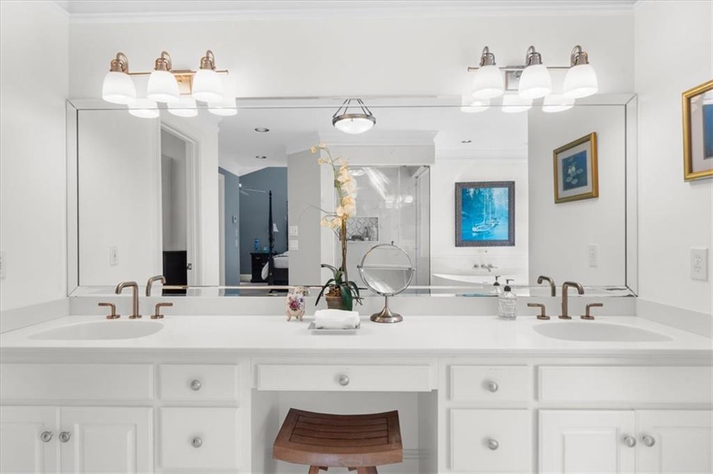 9230 Four Mile Creek Road Gainesville, GA 30506 - Photo 37 of 67 a bathroom with a sink vanity and a mirror