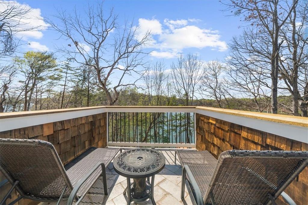9230 Four Mile Creek Road Gainesville, GA 30506 - Photo 41 of 67 a view of balcony with wooden floor and outdoor seating