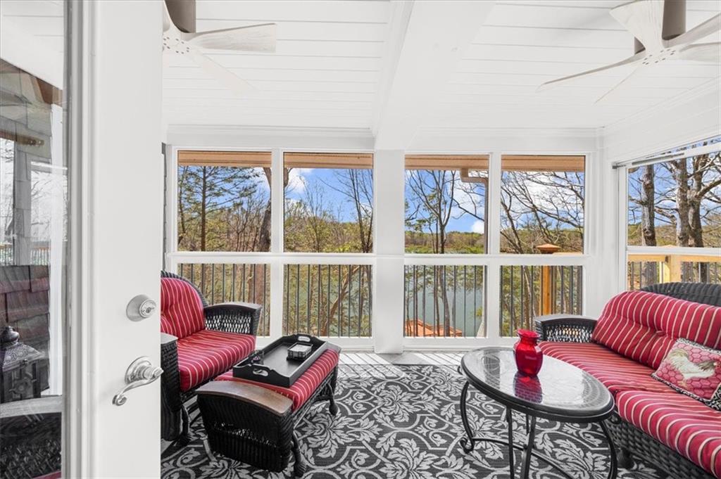 9230 Four Mile Creek Road Gainesville, GA 30506 - Photo 43 of 67 a living room with furniture and a floor to ceiling window