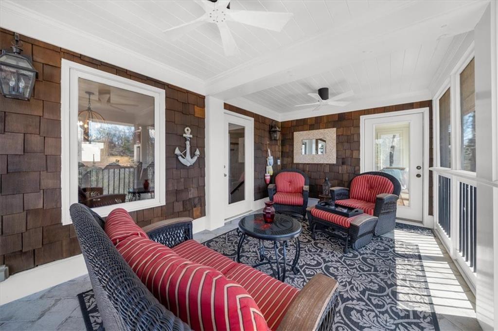 9230 Four Mile Creek Road Gainesville, GA 30506 - Photo 44 of 67 a living room with furniture a rug and a large window
