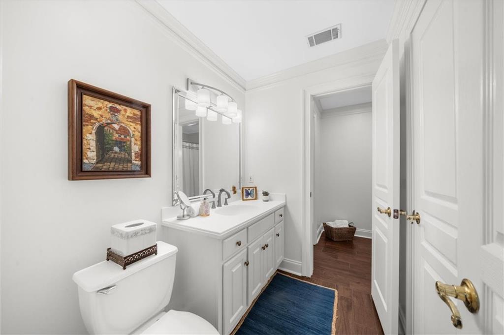 9230 Four Mile Creek Road Gainesville, GA 30506 - Photo 48 of 67 a bathroom with a double vanity sink mirror and toilet
